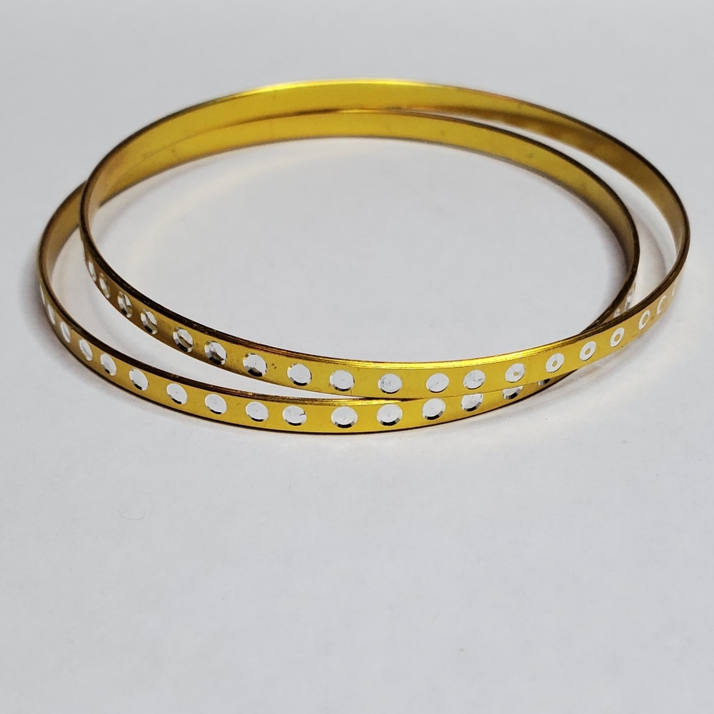Yellow bangle bracelet with white dots around